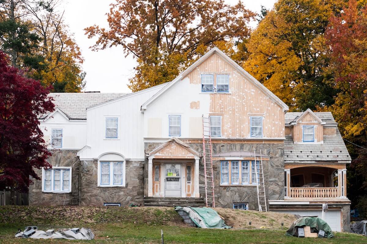 Exterior of a house undergoing painting and renovation