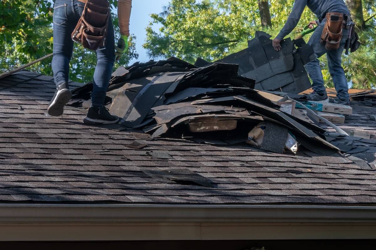 tearing off old roofing